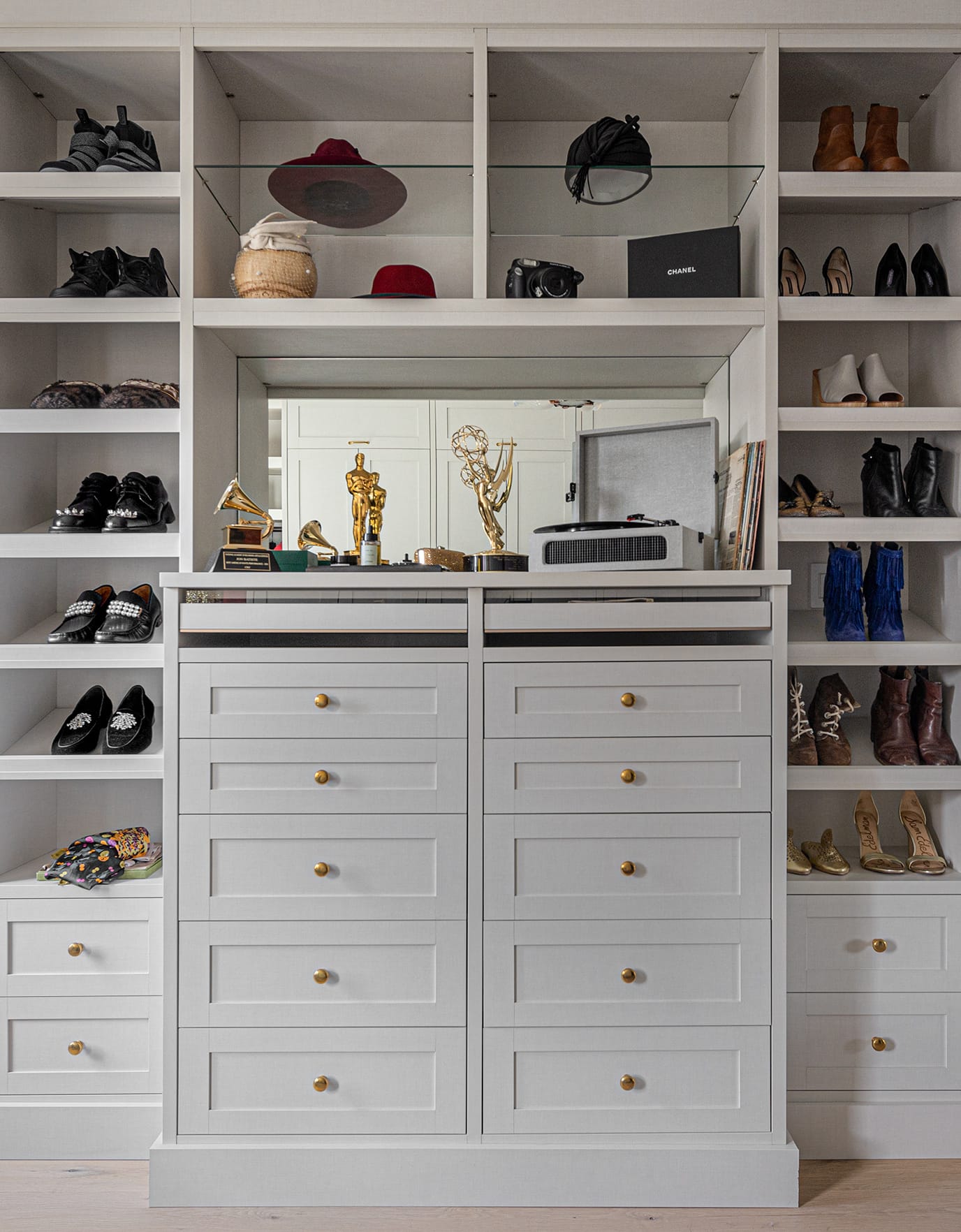 Luxury walk in closet with his and hers wardrobes and shoe shelving created for Suleika Jaouad and Jon Batiste
