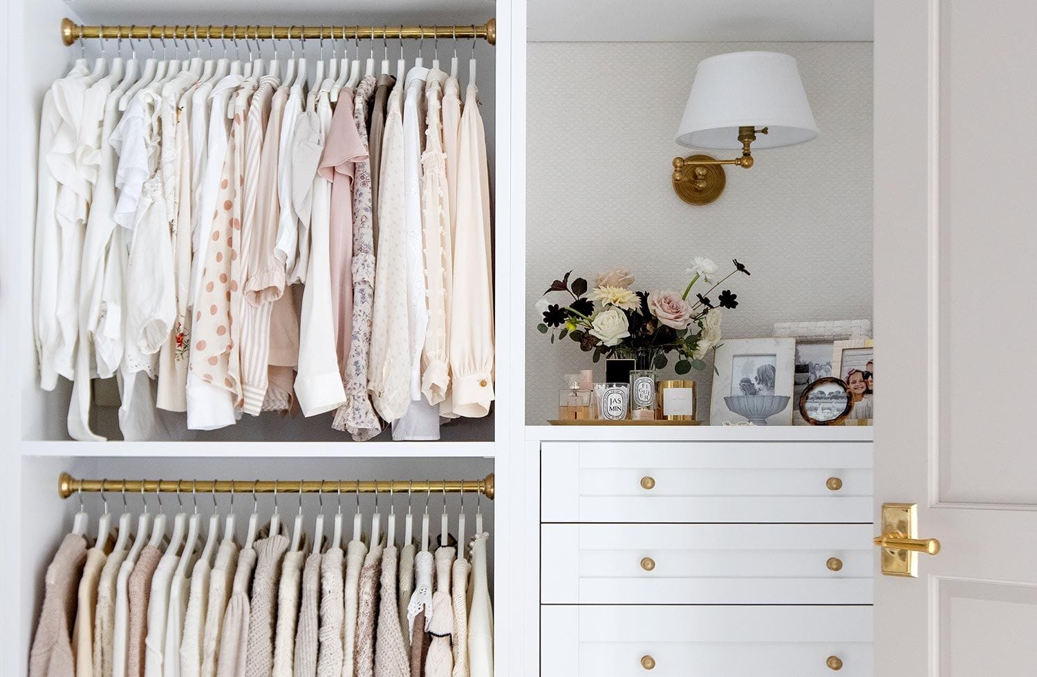 Reach-in layout closet designed with built-in custom drawers from California Closets