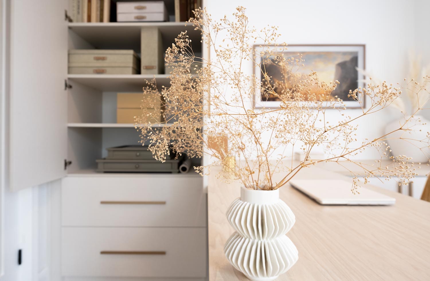 Custom workspace with custom drawers and custom shelving design by California Closets